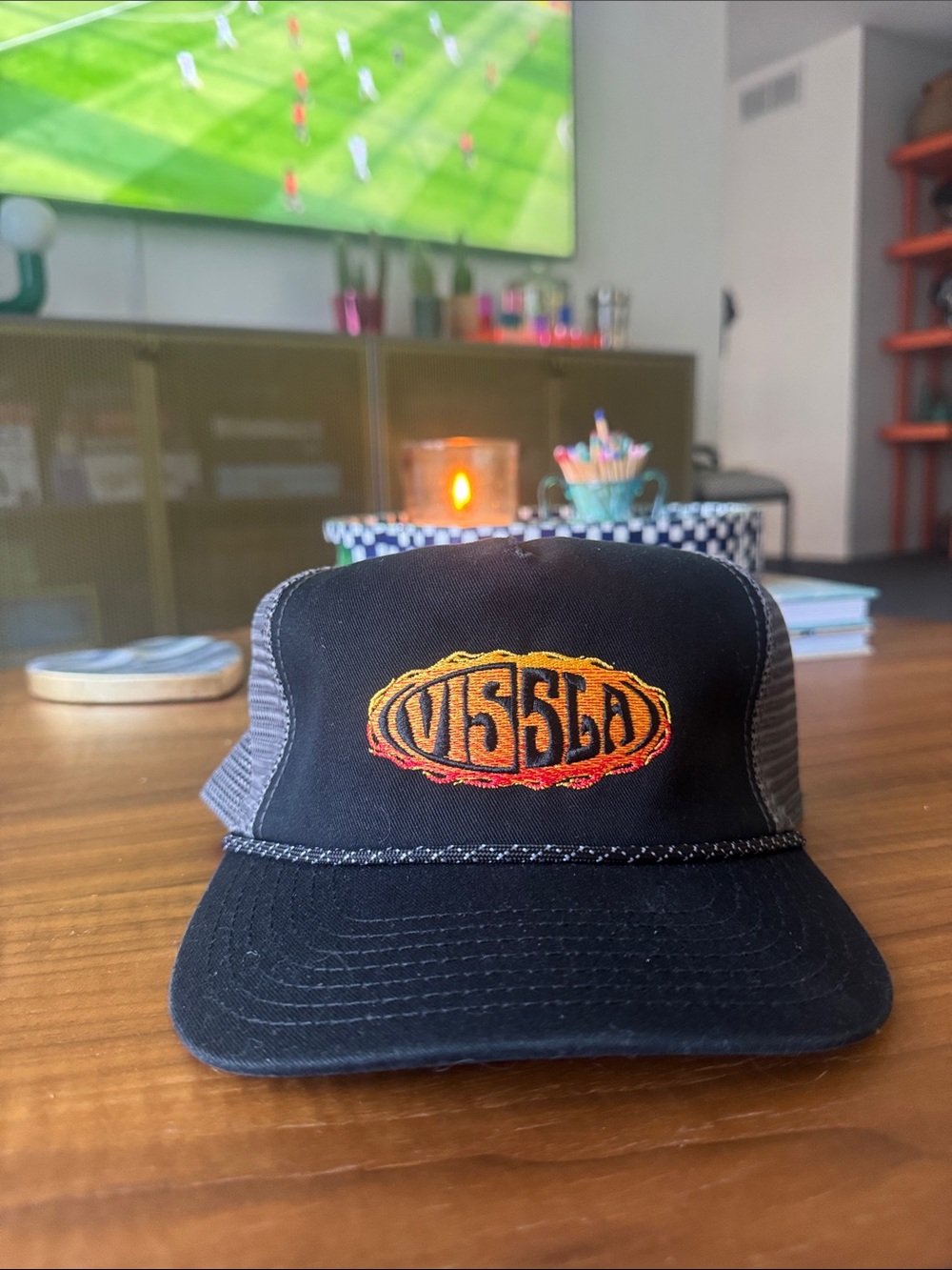 VISSLA Black Trucker Hat with Orange-Yellow Embroidered Logo